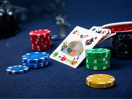 Casino chips and playing cards illustrating the risk of gambling classification